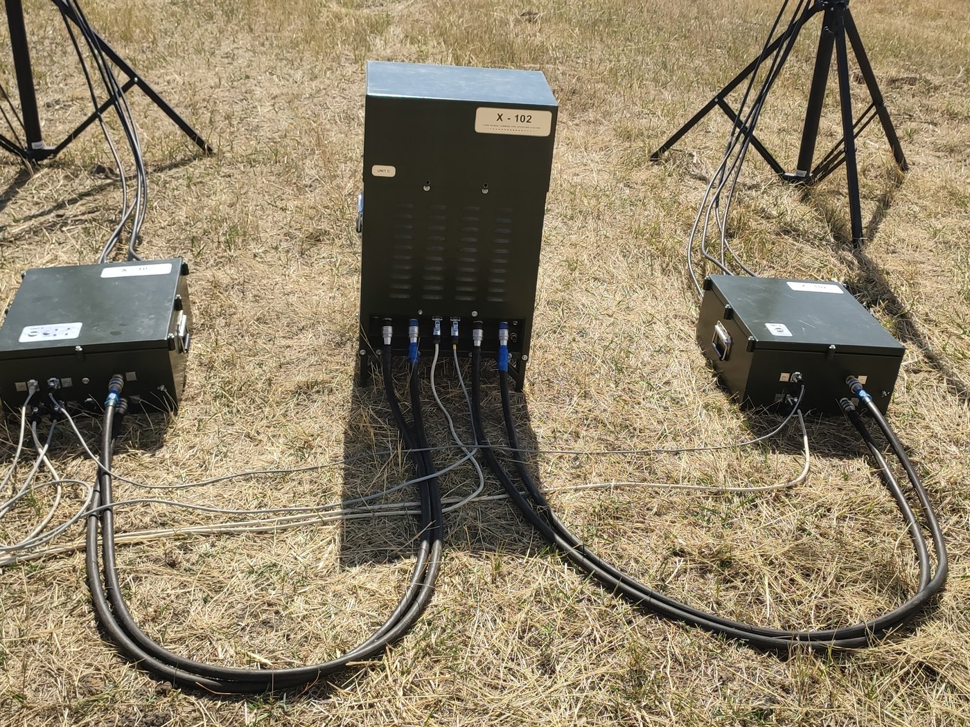 RF units and antenna masts set up in open terrain